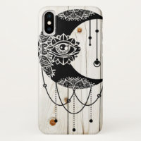 Ornate black moon eye mandala faded wood planks