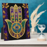 Ornate Gold Third Eye Hamsa Plaque<br><div class="desc">Whether worn as a piece of jewelry, displayed as an art piece, or used as a decorative element, the Hamsa with the third eye serves as a powerful reminder of the importance of spiritual growth, insight, and protection. It encourages individuals to open their minds and hearts to the unseen realms...</div>