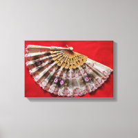 Ornate Hand Held Fan on a Red Background
