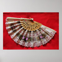 Ornate Hand Held Fan on a Red Background
