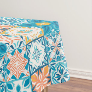 Ornate tiles in blue and orange tablecloth