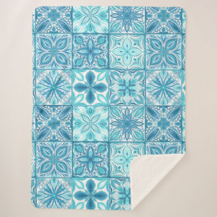 Ornate tiles in blue and white sherpa blanket