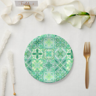 Ornate tiles in green and white paper plate