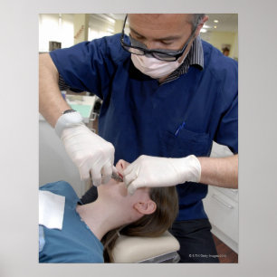 Orthodontist readjusting the dental braces of a poster