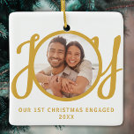 Our 1st Christmas Engaged Photo Gold Keepsake Ceramic Ornament<br><div class="desc">This keepsake First Christmas Engaged photo ornament is decorated with the word JOY in gold,  stylish script typography. Easily customisable.</div>