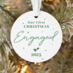Our First Christmas Engaged 2025 – Personalised Ornament<br><div class="desc">Celebrate your engagement and the joy of the holiday season with this beautiful personalised ornament! Featuring the text “Our First Christmas Engaged 2025”, it’s the perfect keepsake to mark the beginning of your forever. Customise with your names, engagement date, or a special message to make it uniquely yours. A meaningful...</div>