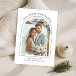 Our First Christmas Newlywed Beach Arch Photo  Holiday Card<br><div class="desc">Celebrate your first Christmas as newlyweds with this beautifully modern photo card, framed by an elegant arched design and set against a soft coastal backdrop. This minimalist yet romantic layout highlights your wedding day joy with refined typography and beach-inspired charm. The tropical floral details and warm neutral tones make it...</div>