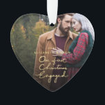 Our First Christmas Together Engaged Photo Heart Ornament<br><div class="desc">This holiday season, send out this beautiful photo Christmas heart-shaped ornament to a newly engaged couple to commemorate their engagement. The ornament features "Our First Christmas Engaged" in a beautifully hand-lettered faux gold foil font with space for one photo. Personalise the ornament by replacing the photo and text. For best...</div>