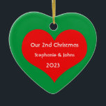 Our Second Christmas Together Cute Red Heart 2023 Ceramic Tree Decoration<br><div class="desc">Personalised names and printed with cute red heart design in solid green background. Feel free to customise by adding your own texts,  names or photos. You can add your photo on the back side of the ornament easily!
The colour of the background can also be changed as you want.</div>