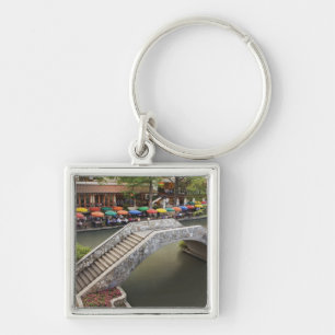 Outdoor cafe along River Walk and bridge over 2 Key Ring