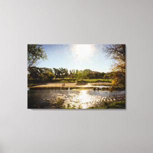 Overview Of The Banks Of A River With Clear Sky Canvas Print