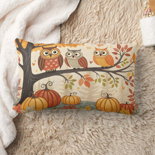 Owls sitting on tree branches with pumpkins lumbar cushion