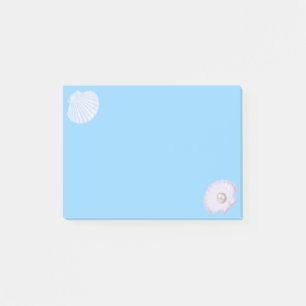 Oyster shell with pearl on light blue post-it notes