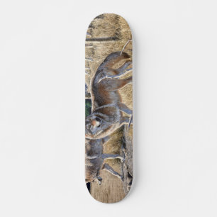Pack of wolves in the forest painting skateboard