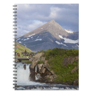 Packers lead string of horses over bridge above spiral notebook