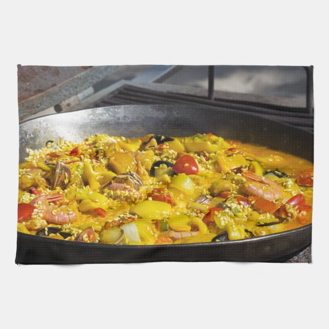 Paella is cooked on a grill tea towel (Horizontal)