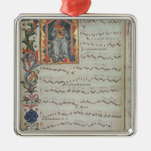 Page of musical notation with historiated metal tree decoration