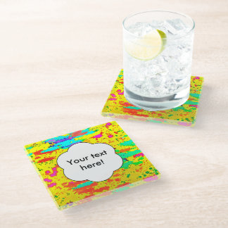 Paint splashes on a yellow background glass coaster