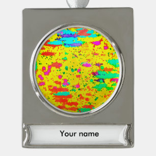 Paint splashes on a yellow background silver plated banner ornament