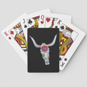 painted cow skull on black playing cards