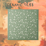 Pale Green with White Florals  Tile<br><div class="desc">Great for bathrooms, backsplash areas, and more. This tile is backed in a pale green with white coloured florals. We have a huge selection of traditional tiles as well as unique tiles to offset your work. A matching plain pale green has also been created for mixing and matching with this...</div>