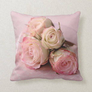 Pale roses on pink swirls cushion