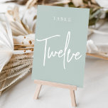 Pale Sage Green Hand Scripted Table TWELVE Table Number<br><div class="desc">Simple and chic table number cards in Pale Sage Green and white make an elegant statement at your wedding or event. Design features "table [number]" in an eyecatching mix of classic serif and handwritten script lettering. Design repeats on both sides. Individually numbered cards sold separately; order each table number individually...</div>