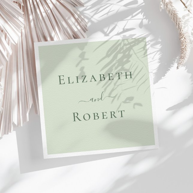 Pale Sage Green Minimalist Couple Names Wedding Napkin (Pale Sage Green Minimalist Couple Names Wedding Napkins on a sunny table with white dry flowers.)