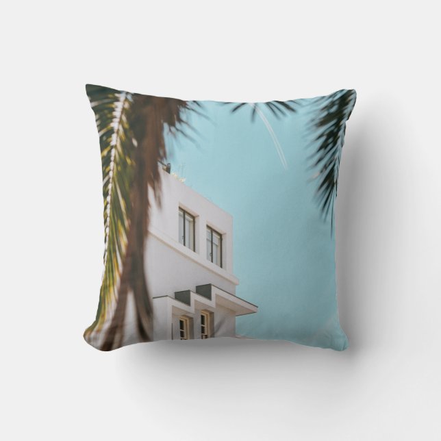 Palm tree near white concrete building cushion (Front)
