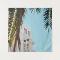 Palm tree near white concrete building