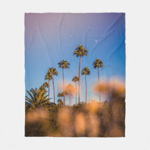 Palm tree under blue sky fleece blanket