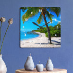 Palm Tree White Sand Hawaii Tropical Beach Photo<br><div class="desc">Rewind back to memories of lazy, tropical beach days whenever you gaze at this Hawaii wall clock of a lone palm tree on a white sand, crescent beach, with clear turquoise blue skies and water. Your choice of a round or square clock face. Makes a great housewarming gift! You can...</div>