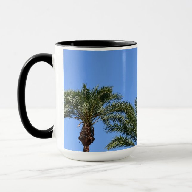Palm trees against the blue sky photo  mug (Left)
