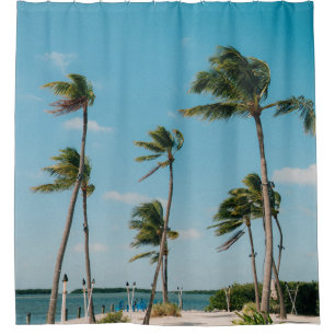 Palm trees on beach shore in the morning shower curtain