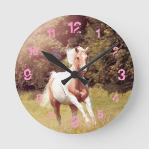 Palomino Paint Horse galloped over a meadow Round Clock