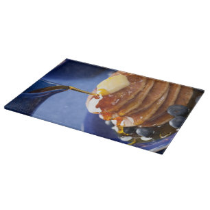 Pancakes with syrup and blueberry cutting board
