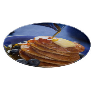 Pancakes with syrup and blueberry cutting board