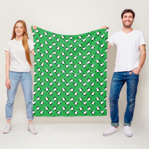 Panda bear laying on grass fleece blanket