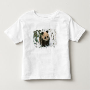 Panda cub on snow, Wolong, Sichuan, China Toddler T-Shirt