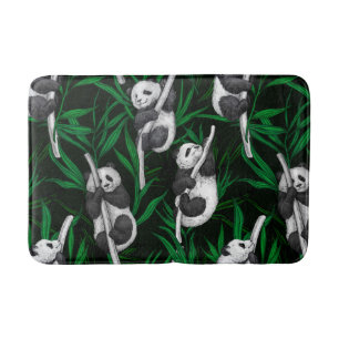Panda cubs on dark green bath mat