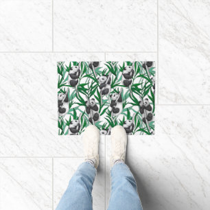 Panda cubs on doormat