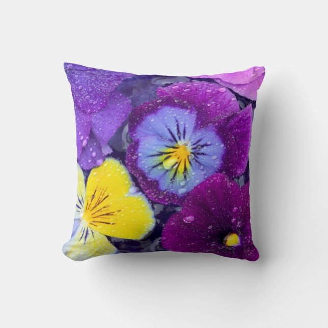 Pansy flowers floating in bird bath with dew cushion (Front)