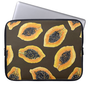 Papaya slices on dark brown laptop sleeve