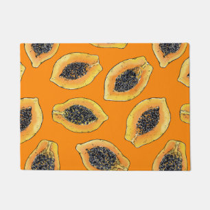 Papaya slices on orange doormat