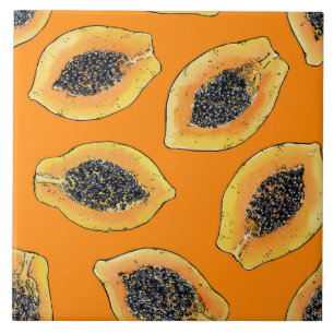 Papaya slices on orange tile