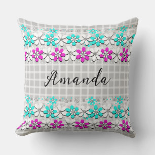 Paper neon flowers on a grey-white chequered cushion