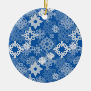 Paper snowflakes and stars on indigo background ceramic tree decoration