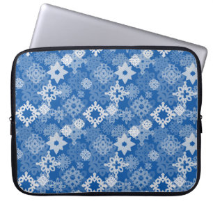 Paper snowflakes and stars on indigo background laptop sleeve