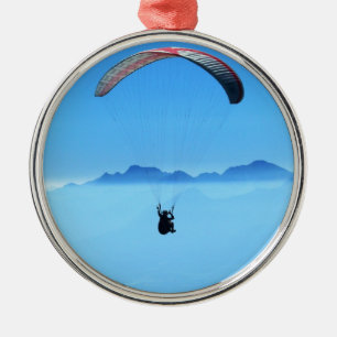 Paraglider on blue background with mountains metal tree decoration