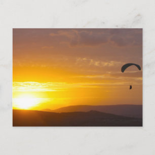Paragliding on the sunset postcard